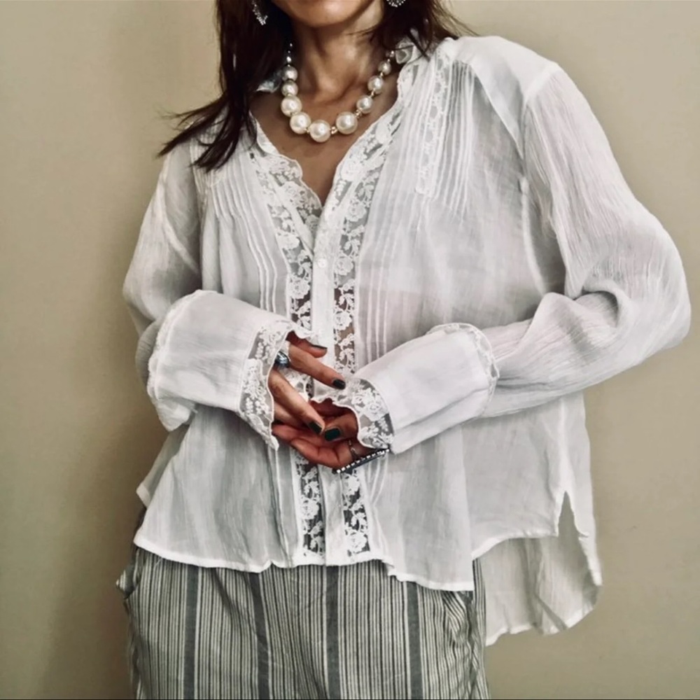New with tags Free People white bohemian blouse, size L.